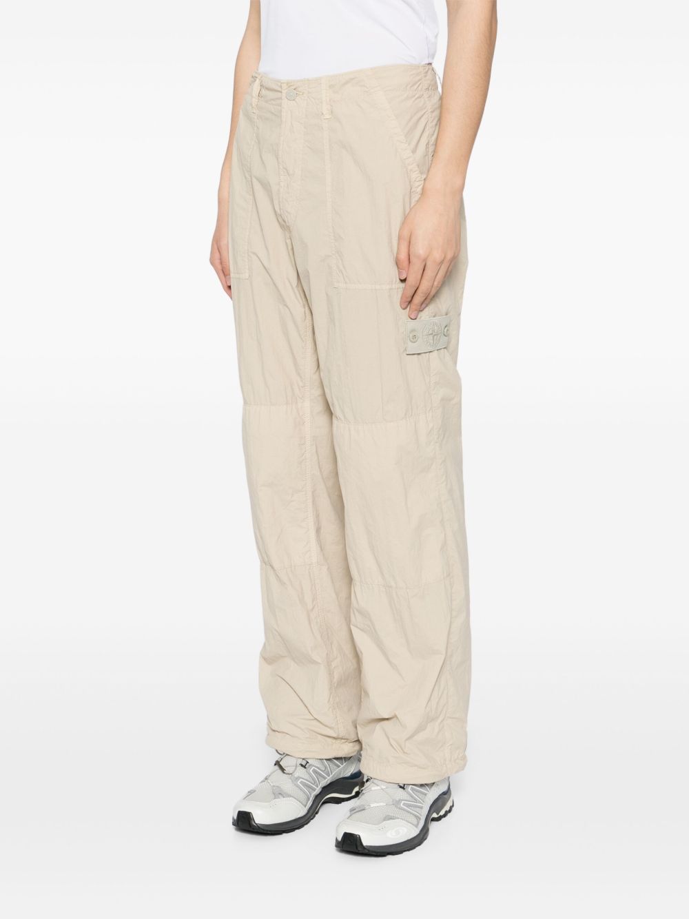 compass-badge trousers